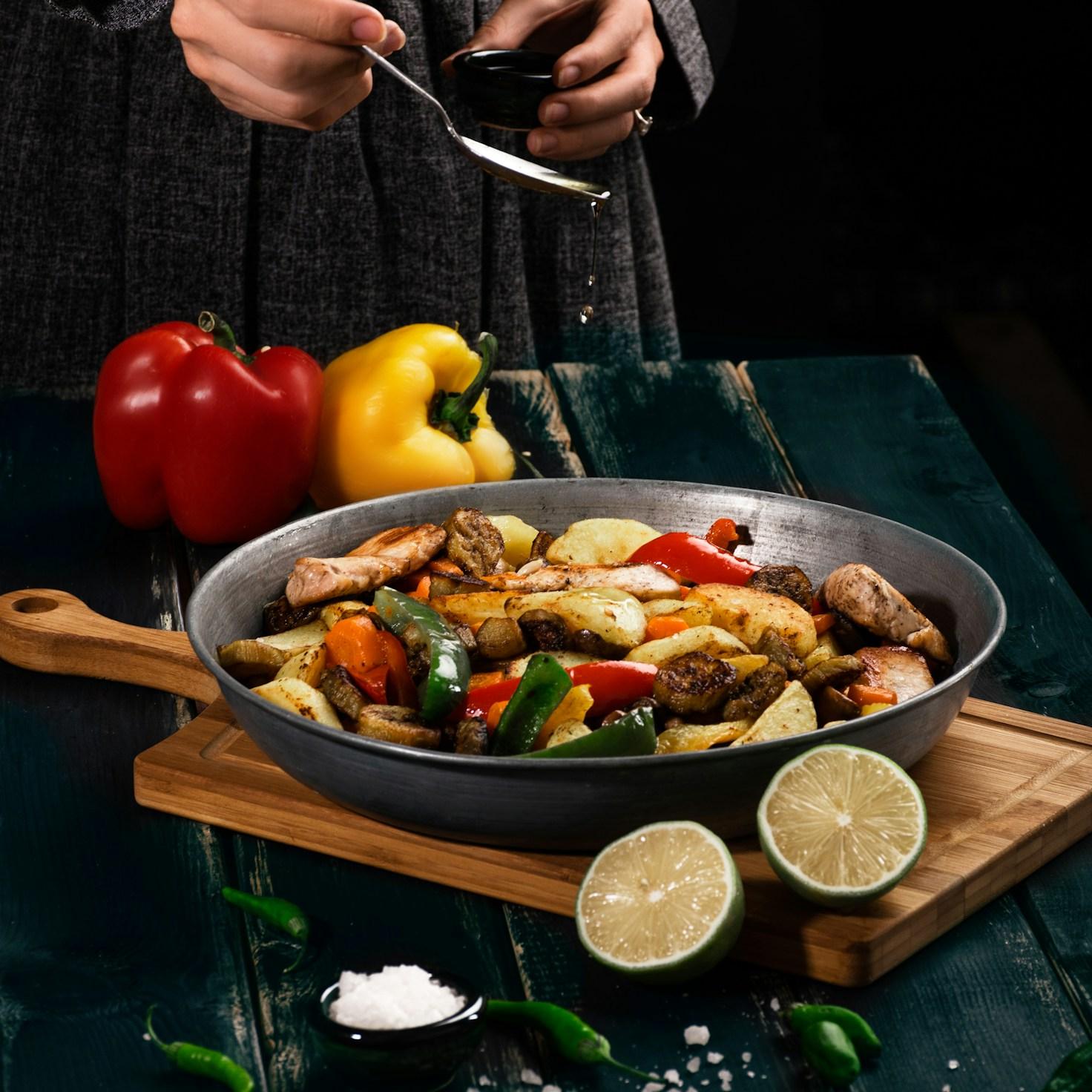 Diverse group sharing a meal together, highlighting the bonds built through collaborative cooking